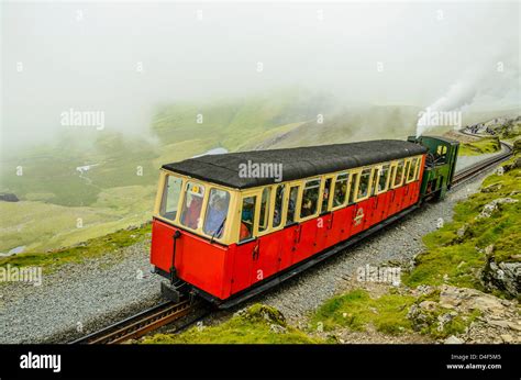 Snowdon Mountain Railway train just below the summit of Snowdon (Yr Wyddfa) Snowdonia North ...