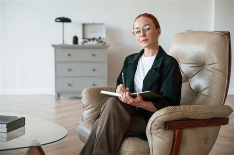 Premium Photo | Woman psychologist in formal clothes is with notepad ...