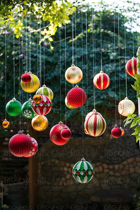 "Many Colorful Christmas Balls Hanging In The Garden With Sunlight" by ...