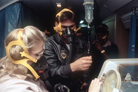 Members Of The 2nd Aeromedical Evacuation Squadron Monitor An Infant