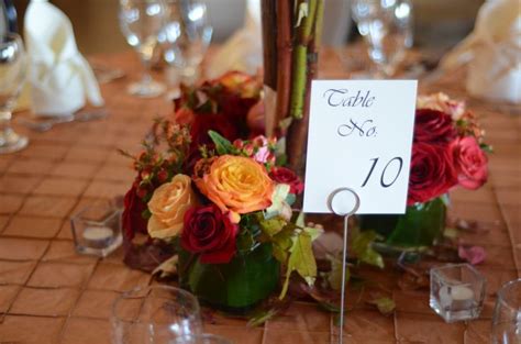 The Table Is Set With Flowers And Place Cards