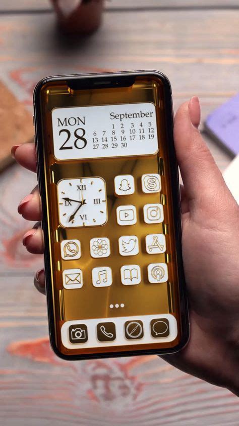 A Person Holding A Cell Phone In Their Hand With The Calendar Displayed