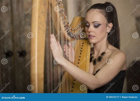 Woman Playing The Harp Stock Image Image Of Necklace