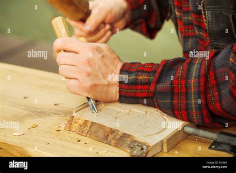 Popular art: wood carving by hand Stock Photo - Alamy