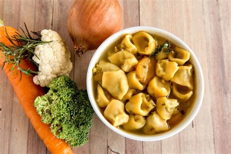 Premium Photo | Cappelletti soup and vegetables cappelletti italian ...