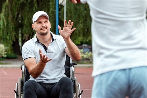 Dad Plays With His Disabled Son On The Sports Ground Concept