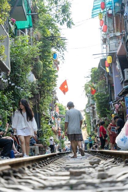 Premium Photo Tourists Taking Pictures Of Hurtling Train The Hanoi