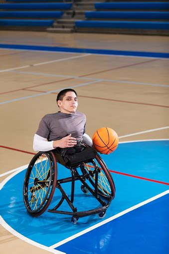 Man With Spina Bifida Playing Wheelchair Basketball Stock Photo