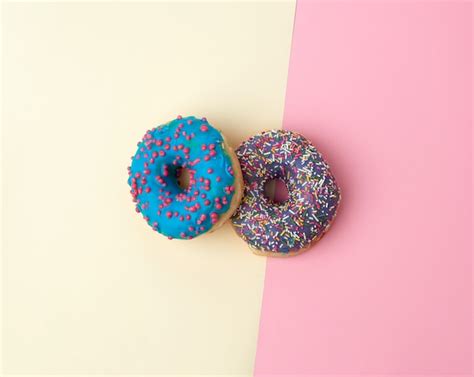 Premium Photo Whole Round Pink Donuts With Colored Sprinkles