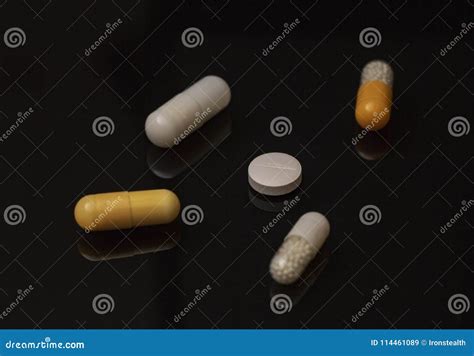 Heap Of Colorful Drugs And Pills On Black Background Stock Image