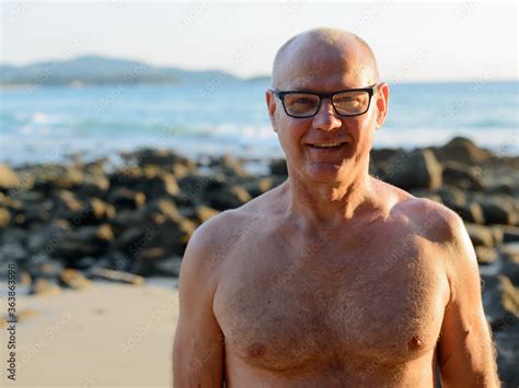Happy Mature Handsome Tourist Man Smiling Shirtless At The Beach Stock Photo Adobe Stock