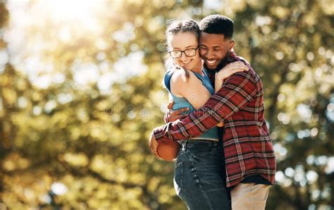 Football Love And Interracial Couple With A Hug In Nature For Sports Playful And Bonding