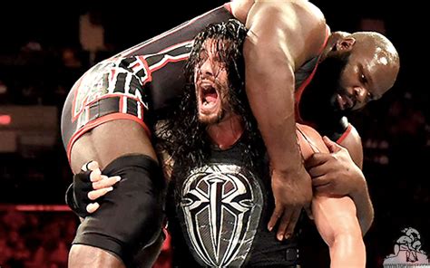 Roman Reigns Lifting Mark Henry On Shoulders Roman Reigns Lifts Big