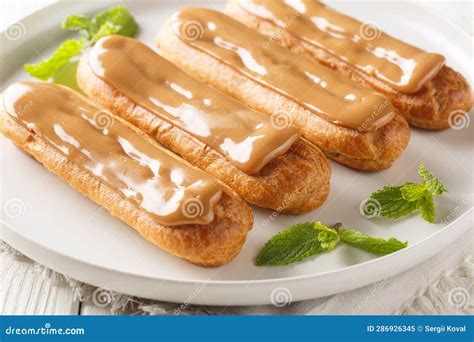 French Sweet Eclairs with Cream Filling and Topped with Soft Delicate ...