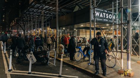 Migrants Protest Move From Midtown Hotel To Barracks Style Shelter