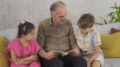 Grandpa Reading To His Grandchildren Knowledgeable Grandfather Reading