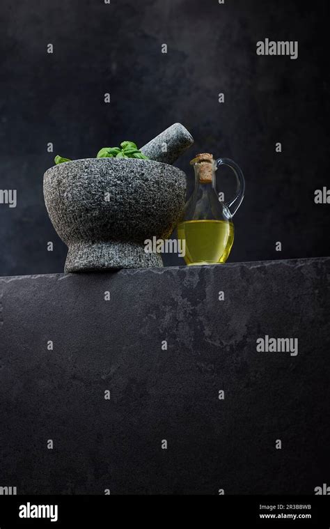 Studio Shot Of Jug Of Olive Oil And Stone Mortar Stock Photo Alamy