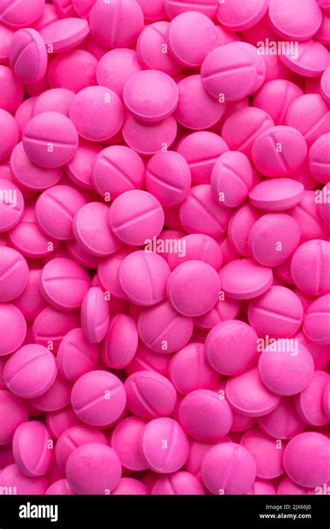 Pile Of Pink Round Pills Or Tablets Medical Drugs Taken Straight From