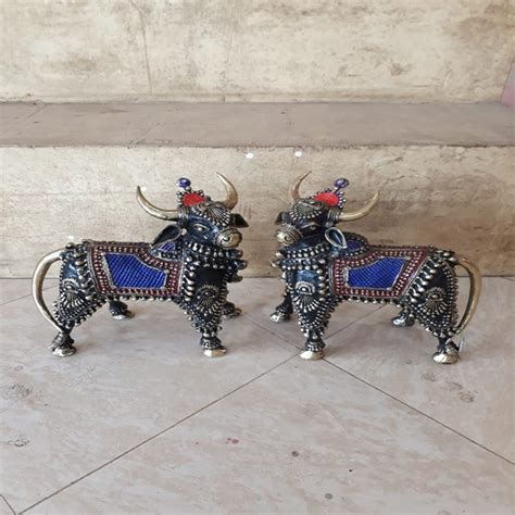 Handmade metal statue of Standing Nandi Pair - directcreate.com