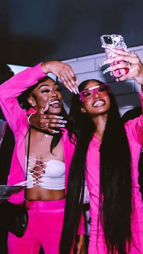 Download Two Women In Pink Outfits Taking A Selfie Wallpaper | Wallpapers.com