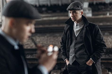 Premium Photo | Brutal gangsters posing on background of railway ...