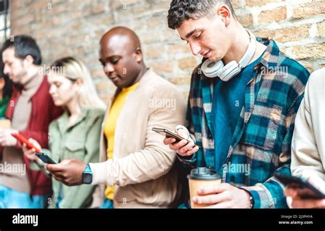 Multicultural People Group Using Smartphone With Coffee At University