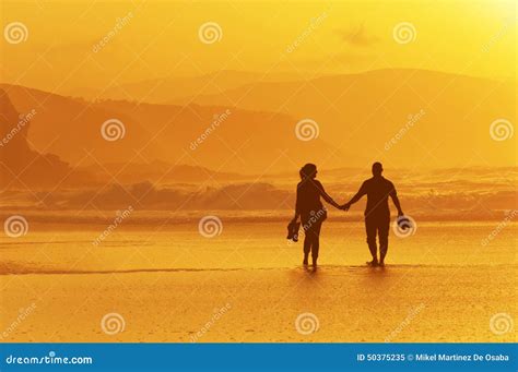 Couple Walking On Beach At Sunset Stock Image Image Of Summer