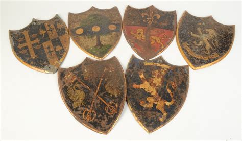 A Group Of Six Heraldic Japanned Metal Shields Height 225cm Width 17cm