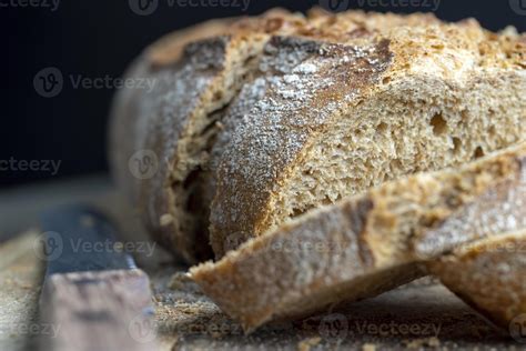 Dark wheat loaf of bread 13647248 Stock Photo at Vecteezy