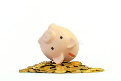 Inverted Piggy Bank On Golden Coins Isolated On White Background On