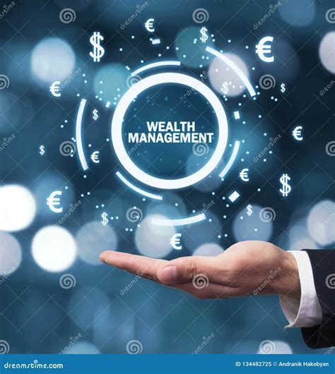 Male Hand Holding Wealth Management Word With Currency Symbols Stock