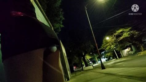 Sissy Crossdresser Walking Outside With A Vibrator Inside Her Ass And A Micro Chastity Cage