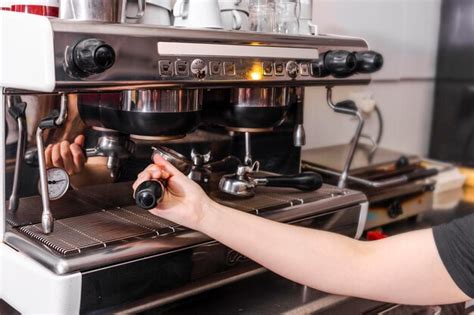 Premium Photo | Barista making coffee at coffee machine