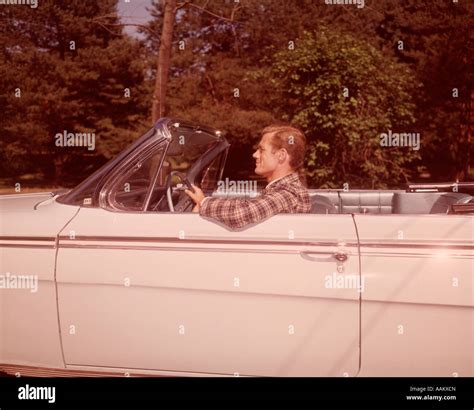 1960s PROFILE MAN DRIVING WHITE CONVERTIBLE AUTOMOBILE Stock Photo - Alamy