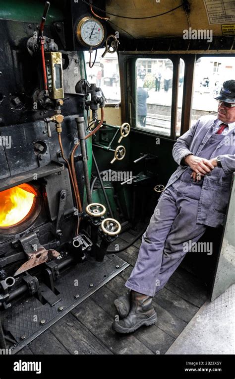 A Steam Engine Driver On The Footplate Of The Steam Locomotive No