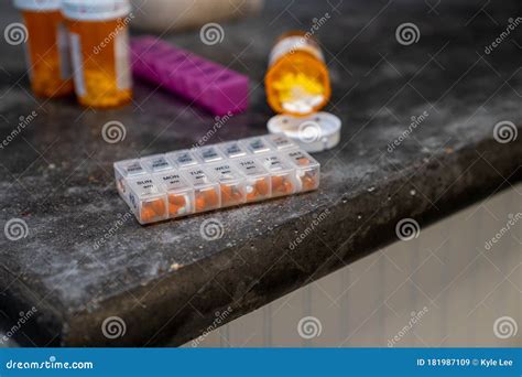 Multiple Types Of Prescription Pills Coming Out Of Bottle With Daily