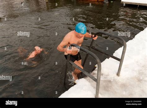 Winter Swimmers Braves The Snow And Ice For Their Daily Swim In Highgate Mens Bathing Pond