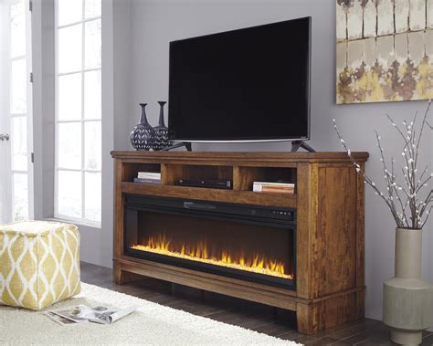 Ralene Medium Brown Xl Tv Stand With Fireplace Audio Option Marjen Of Chicago Chicago