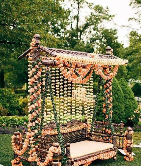 indian wedding decor outdoor seating  flowers  candles