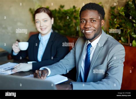 Two Business People During Work Meeting In Modern Cafe Handsome African American Businessman