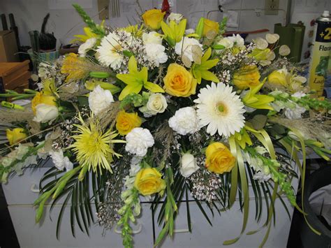 Casket Spray In Yellows And Whites With Roses Gerbera Daisies