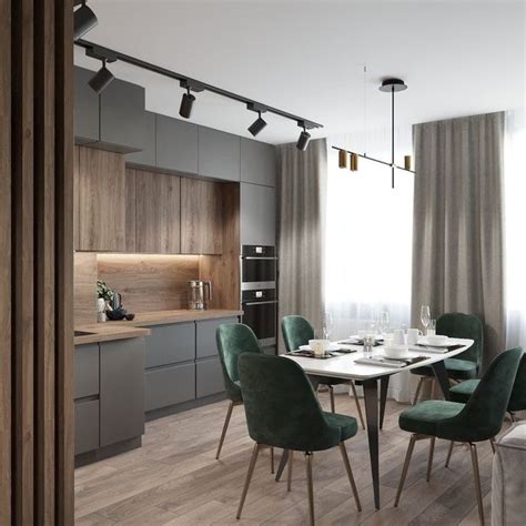 A Dining Room Table With Green Chairs Next To A Kitchen