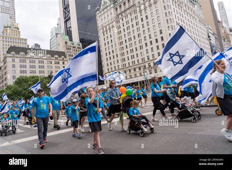 New York New York June 04 Participants Holding Israeli Flags And Signs March Up Fifth Avenue