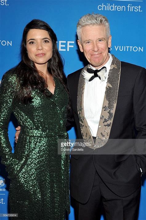 Mariana Teixeira De Carvalho And Musician Adam Clayton Attend The