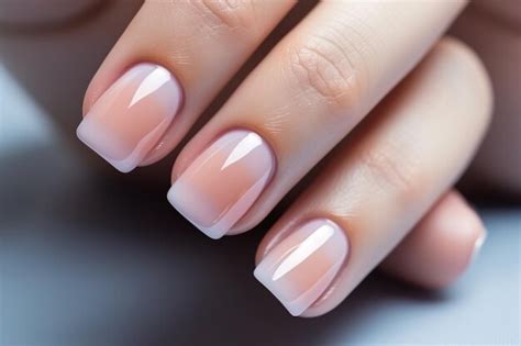 Premium Photo Woman Hand With Nude Shades Nail Polish On Her