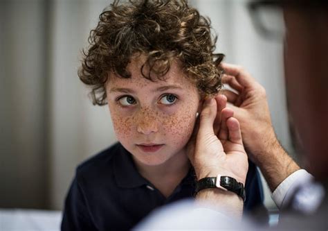 Young man with hearing aid | Royalty free photo - 260695
