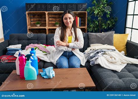 Young Latin Woman Doing Laundry At Home Happy Face Smiling With Crossed