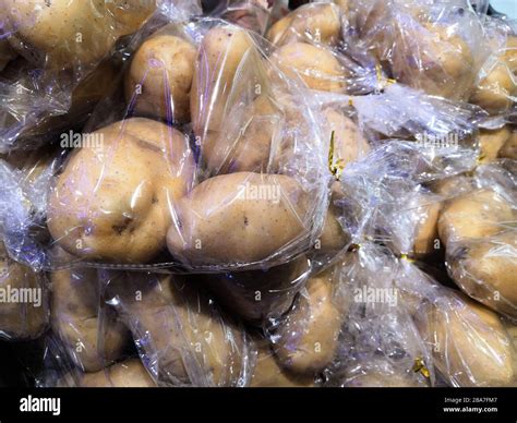 Plastic Bags With Potatoes In A Supermarket Stock Photo Alamy