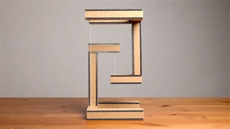 A Simple Yet Ingenious Cardboard Sculpture That Provides The Illusion