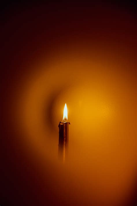 Close Up Photograph of Person Praying in Front Lined Candles · Free ...